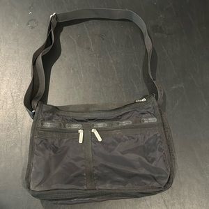 LESPORTSAC Deluxe Everyday Bag Solid Black Expandable Crossbody Sling Bag